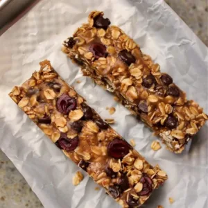 Homemade chewy granola bar made with oats, nuts, and honey