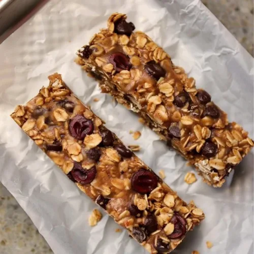 Homemade chewy granola bar made with oats, nuts, and honey