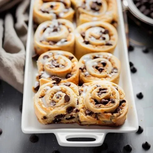 Delicious chocolate chip cookie rolls displayed on a platter.