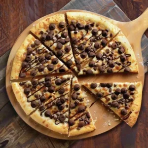 Delicious Chocolate Chip Dessert Pizza with melted chocolate chips and fresh toppings