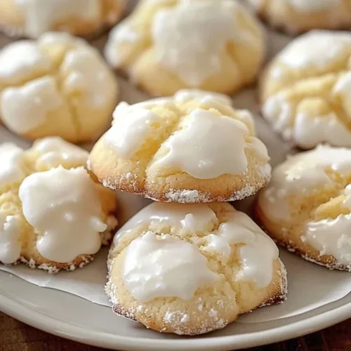 Dreamy Kentucky Butter Cake Cookies on a plate, showcasing buttery texture and golden color.