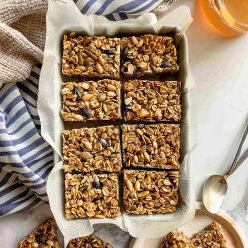 Homemade granola bars made with oats, nuts, and dried fruits
