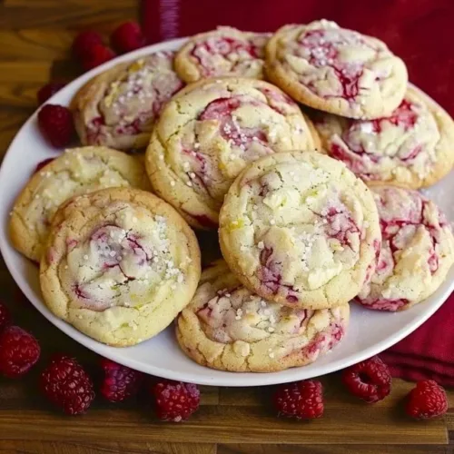 Freshly baked Lemon Raspberry Cookies with lemon zest and raspberry chunks