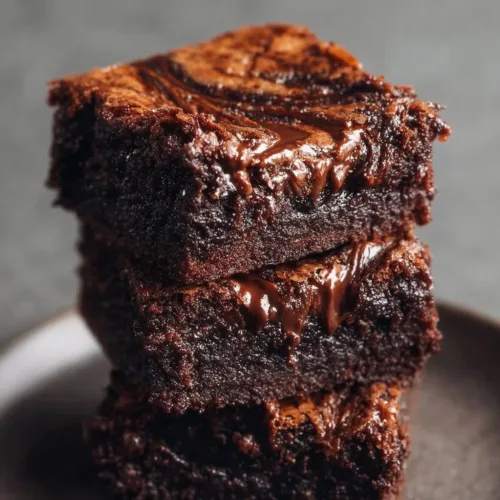 Nutella swirl fudgy brownies fresh out of the oven, rich chocolate dessert.